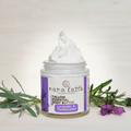 Jar of nana latta tallow essential body butter with lavender and frankincense on a light background