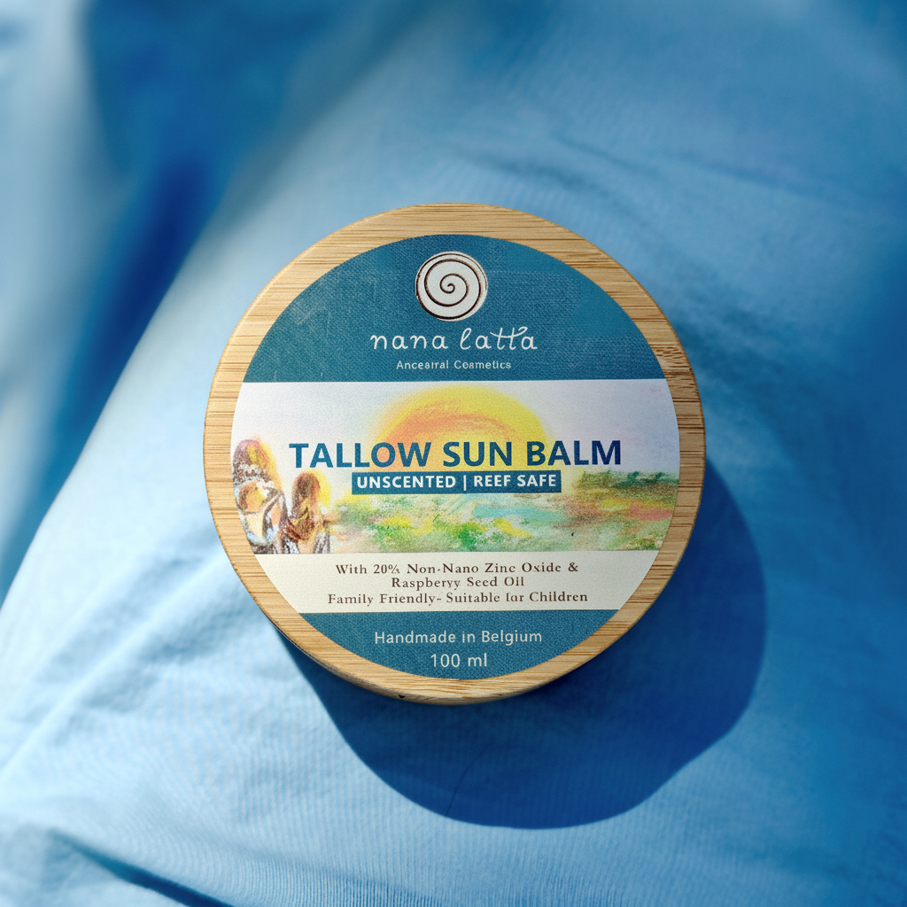 Tallow sun balm container with label on a blue fabric background